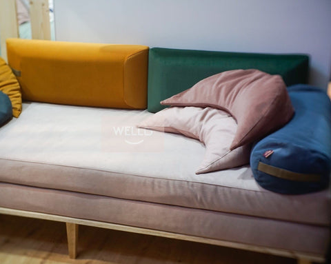 buckwheat and polyurethane foam cushions in different colours lying on the sofa