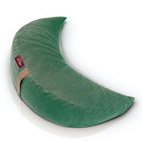 buckwheat half-moon cushion in a green velour cover