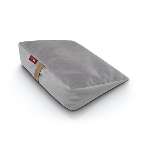 Wedge pillow for sitting in a light grey velour cover